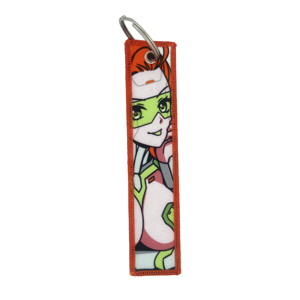 Keychain with a repeating design of a red-haired woman in a white and green futuristic suit with green glasses.