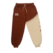 Rust-colored fabric with a white embroidered "G" logo featuring star details on the sweatpants.