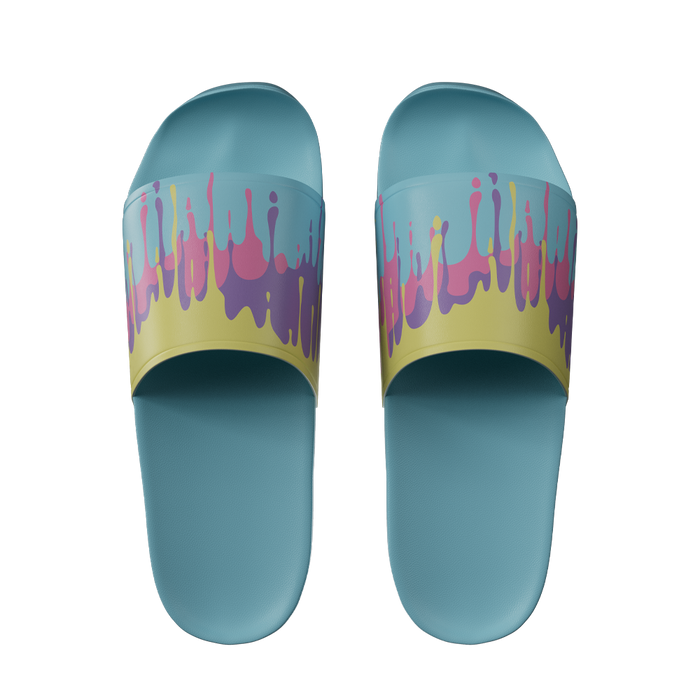 Light blue slides with yellow straps featuring pink and purple paint drip patterns across the top band.