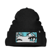Black knit beanie with a folded cuff featuring a patch of a winking anime face with blue hair and Japanese characters.